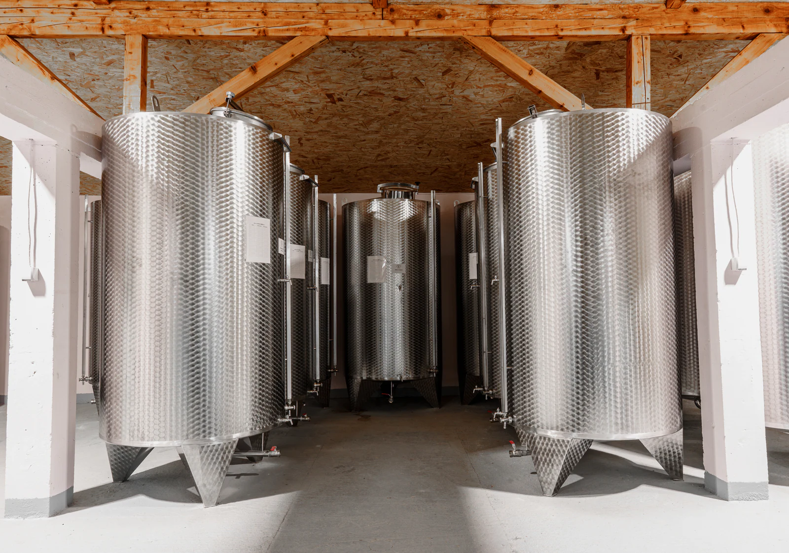 Rows of stainless steel tanks inside Destilerija Kulina.
